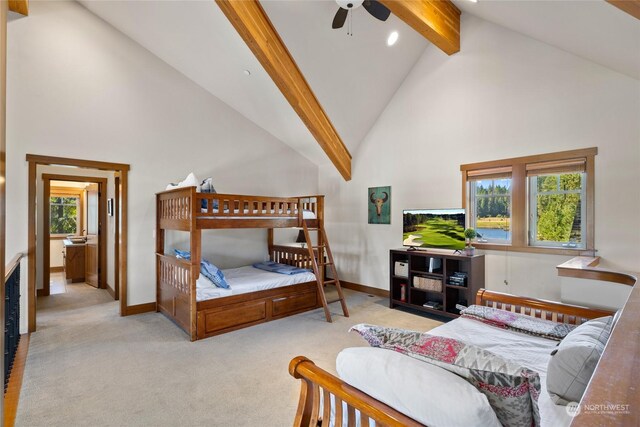 carpeted bedroom featuring ceiling fan, beam ceiling, multiple windows, and high vaulted ceiling