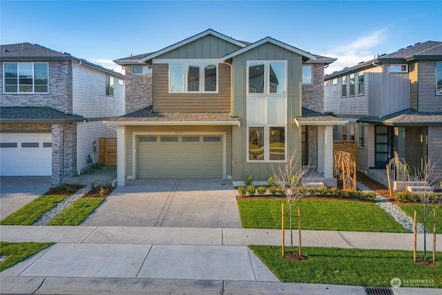 view of front facade with a garage and a front yard