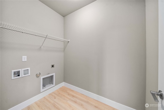 washroom with hookup for an electric dryer, hookup for a washing machine, hardwood / wood-style flooring, and hookup for a gas dryer