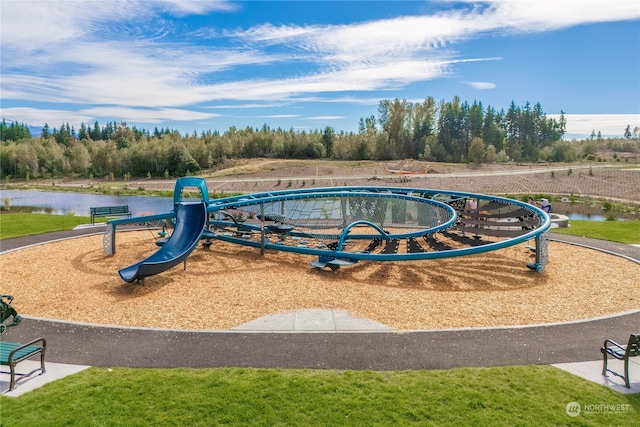 view of jungle gym featuring a water view