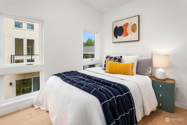 bedroom with hardwood / wood-style floors