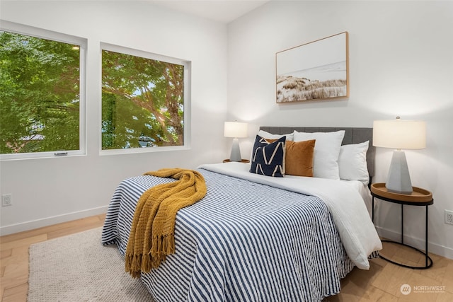 bedroom with light hardwood / wood-style floors