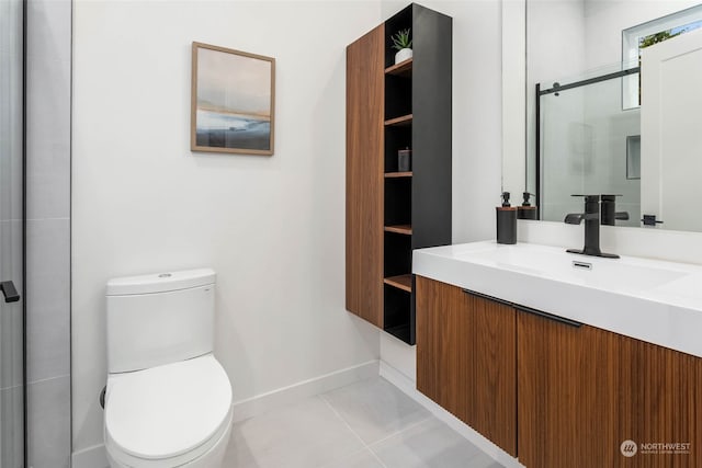 bathroom with vanity, toilet, a shower with shower door, and tile patterned flooring