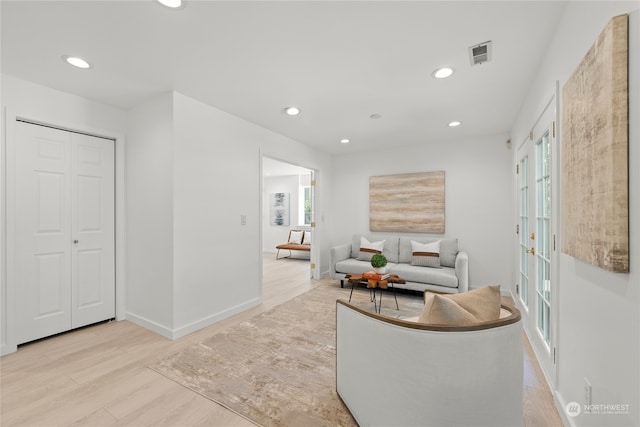 sitting room featuring light hardwood / wood-style flooring