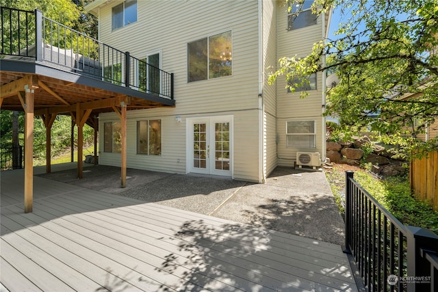 deck with a patio area and ac unit