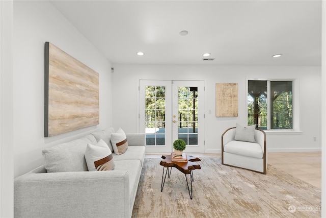 living room with french doors and wood-type flooring