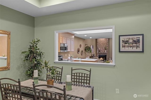 dining area with a large fireplace