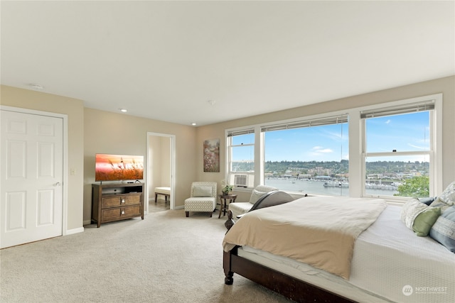 bedroom featuring cooling unit and carpet