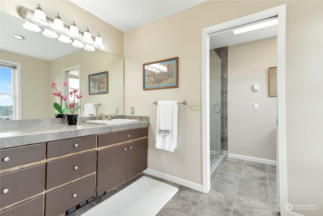 bathroom with tile patterned flooring, vanity, and an enclosed shower