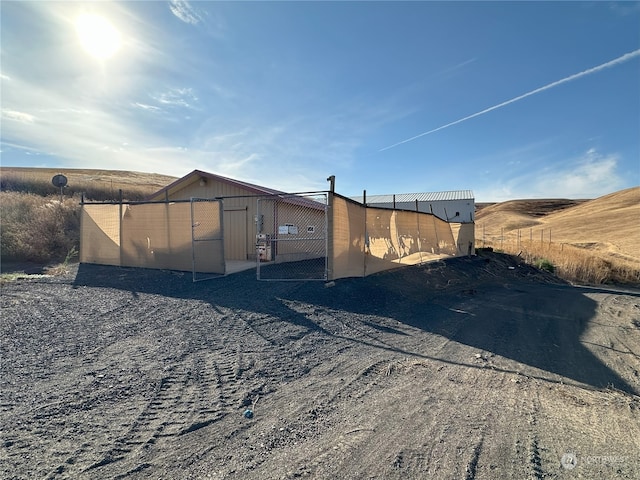 view of side of property featuring a rural view