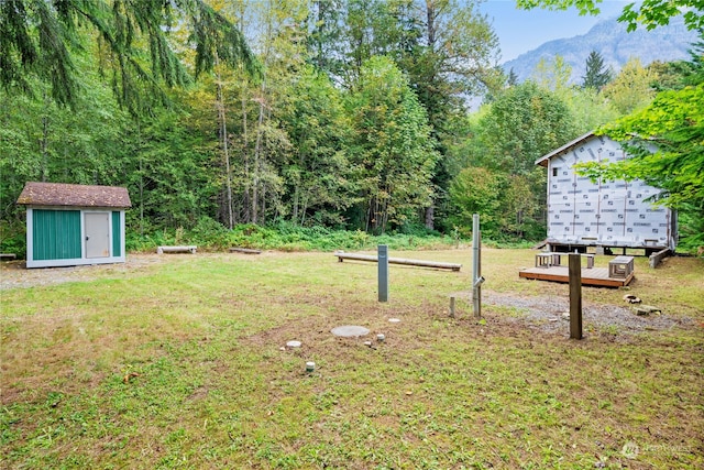 18322 642nd Ave NE, Baring, WA 98224 - view of yard featuring a storage unit, a mountain view, and mail boxes