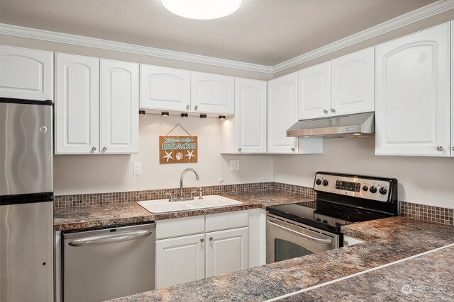 kitchen with ornamental molding, white cabinetry, appliances with stainless steel finishes, and sink