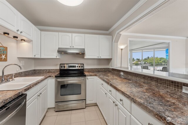 kitchen with white cabinets, ornamental molding, appliances with stainless steel finishes, and sink