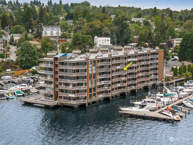 birds eye view of property with a water view