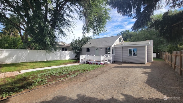 back of house with a yard