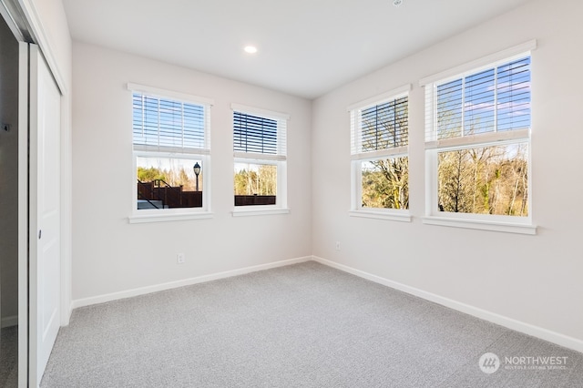 empty room with carpet and a healthy amount of sunlight