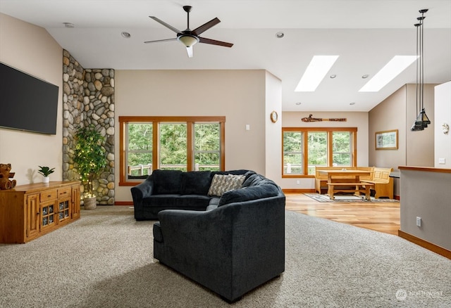 living room with wood-type flooring, vaulted ceiling, and ceiling fan