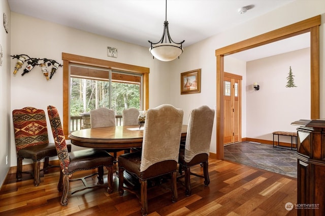 dining room with dark hardwood / wood-style floors