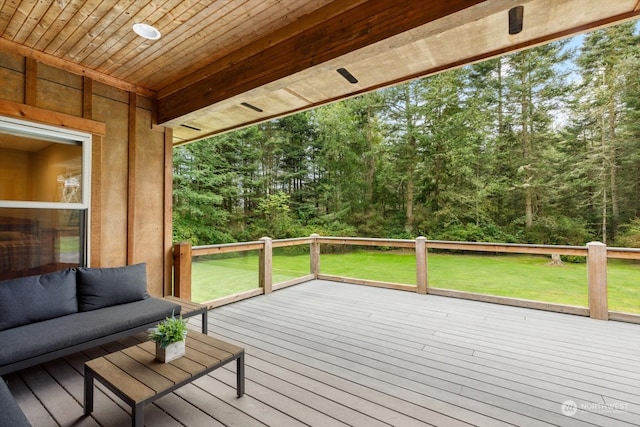 wooden deck featuring a yard and outdoor lounge area