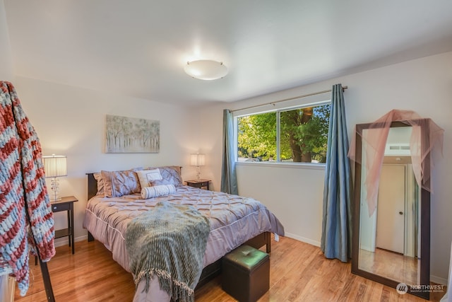 bedroom with light wood-type flooring