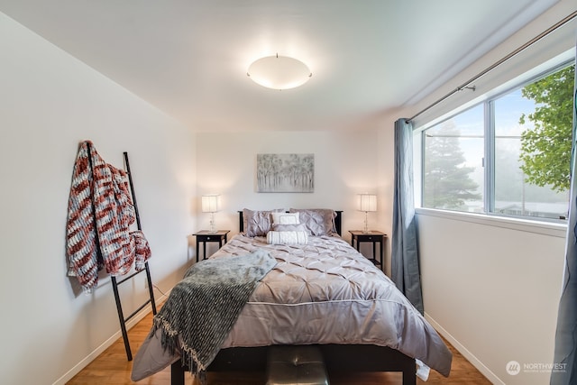 bedroom with light hardwood / wood-style floors