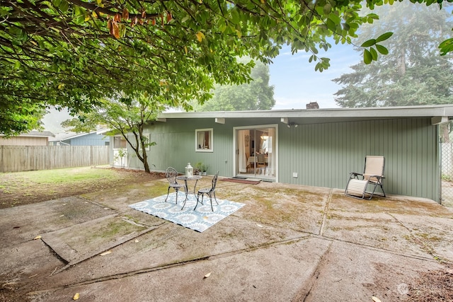 back of house with a patio