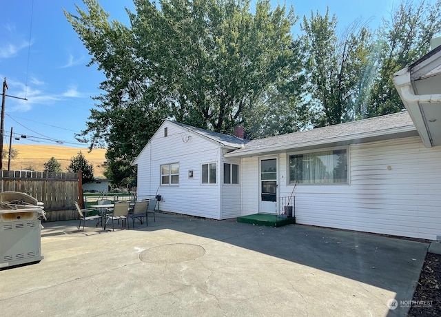 back of property with a patio