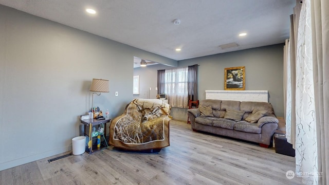 living room with light hardwood / wood-style floors