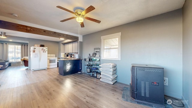 miscellaneous room with light hardwood / wood-style flooring, beamed ceiling, and ceiling fan