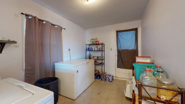 washroom with washer / dryer