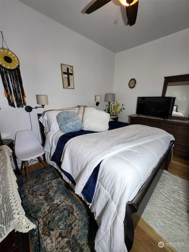 bedroom with hardwood / wood-style floors and ceiling fan