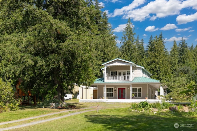 view of front of property with a balcony, a front lawn, and a porch