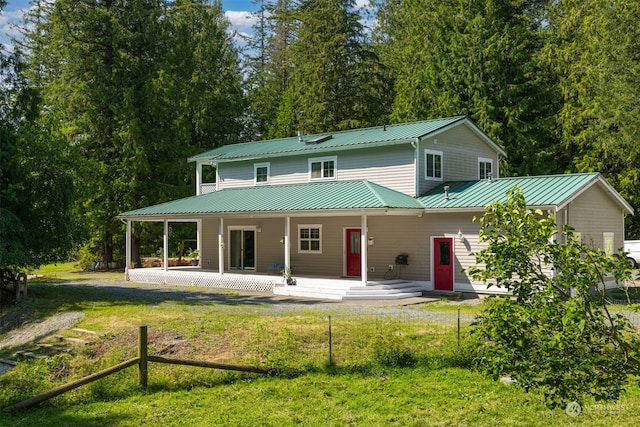 view of front of house with a front lawn and covered porch