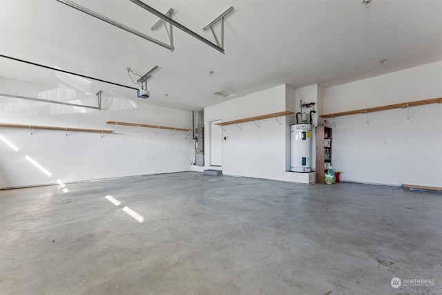 garage featuring water heater and a garage door opener