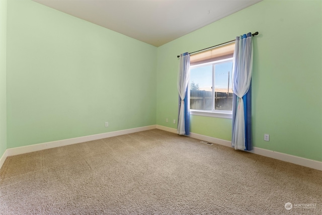 unfurnished room with carpet flooring