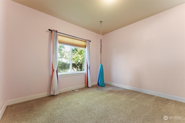 unfurnished room featuring carpet flooring