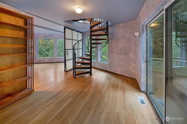 interior space featuring a wealth of natural light and light hardwood / wood-style flooring