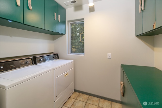 laundry area with cabinets and separate washer and dryer