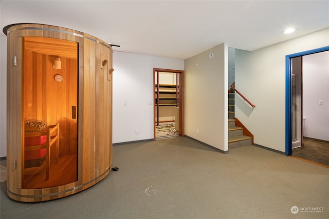 interior space featuring dark colored carpet