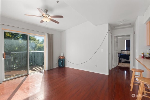 interior space with dark hardwood / wood-style floors and ceiling fan