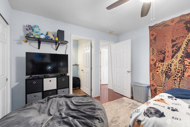 bedroom with ceiling fan and hardwood / wood-style flooring