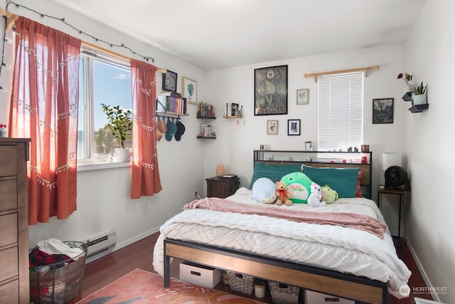 bedroom with hardwood / wood-style flooring