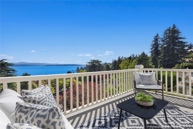 wooden deck with a water view