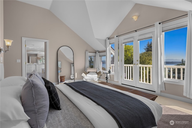 carpeted bedroom with french doors and vaulted ceiling