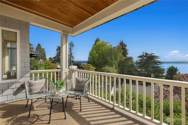 balcony featuring a water view