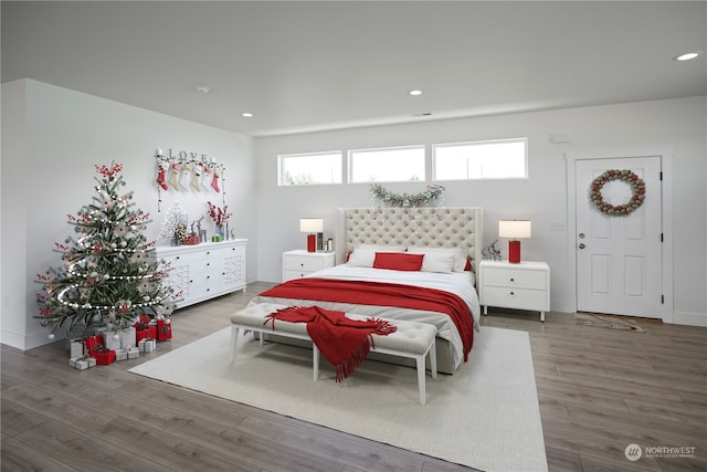 bedroom with wood-type flooring