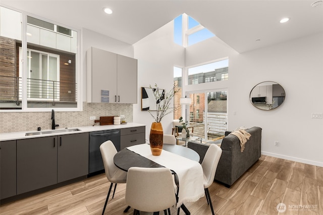 dining area featuring baseboards, recessed lighting, and light wood-style floors