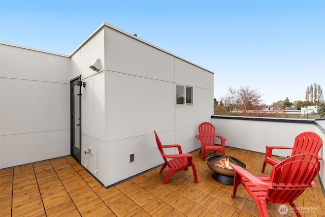 view of patio / terrace with an outdoor fire pit