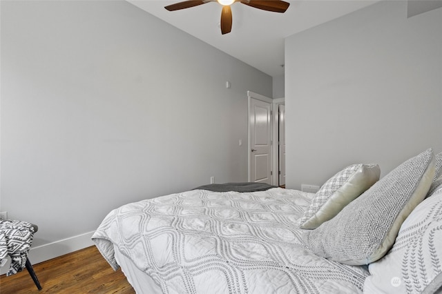 bedroom with wood-type flooring and ceiling fan