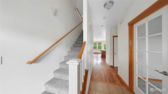 stairway featuring hardwood / wood-style floors